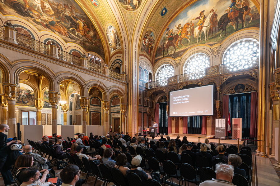 Wideshot of Oliver Laric's keynote for Vienna Digital Cultures 2026 at Museum of Military History in Vienna.