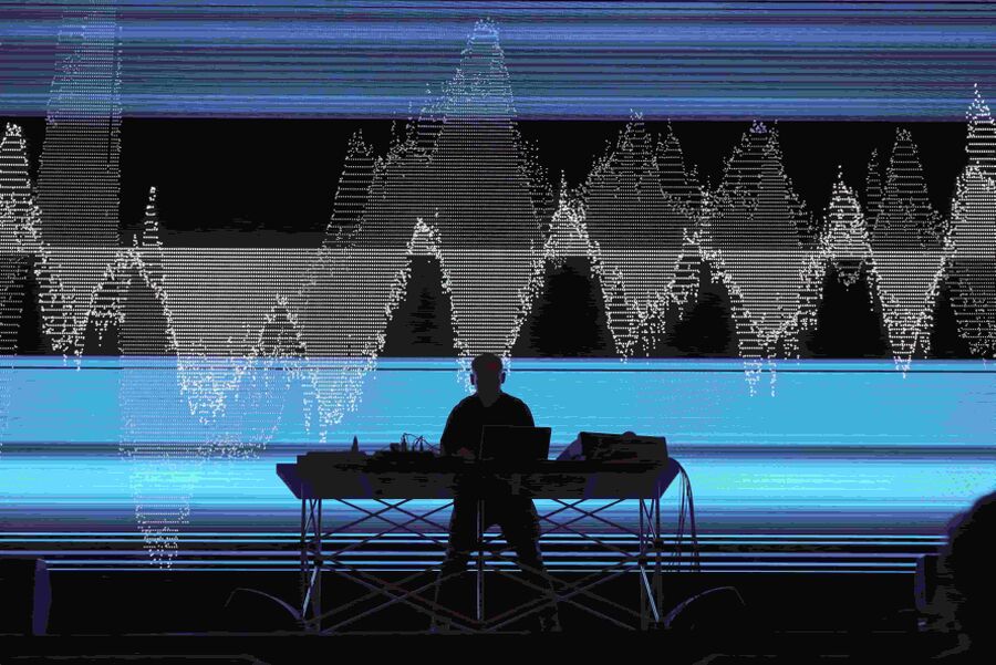 Alva Noto (Carsten Nicolai) performing a live audio-visual DJ set.
