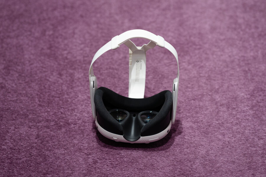 Photo from the Fields of Vision exhibition, showing a VR headset laid down on a purple carpet